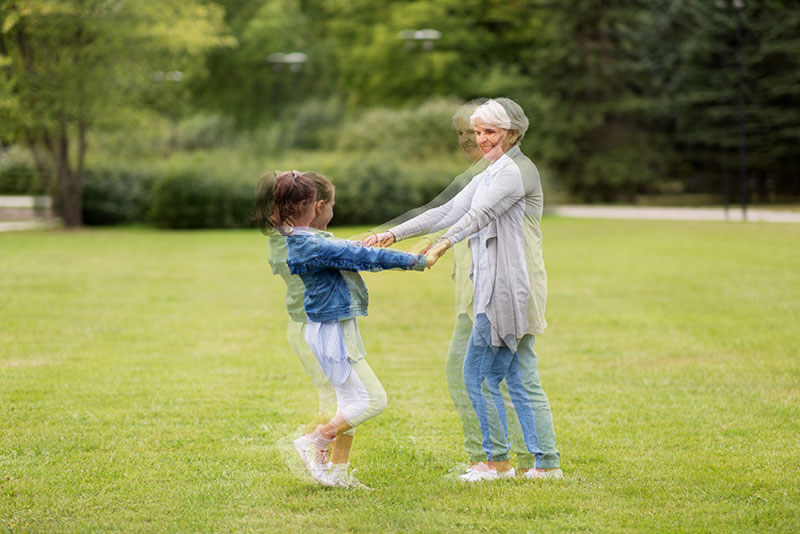 Older Woman Playing With Her Granddaughter - Double Vision