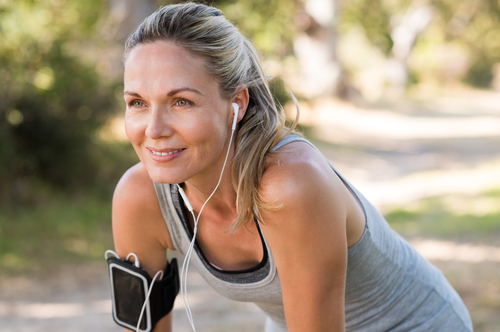 Lady running outdoors and smiling 