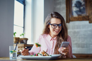 girl eating food at table 