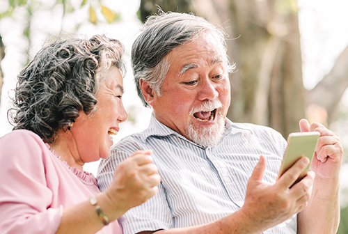 Man with implantable contact lenses looking at his social media