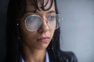 woman wearing glasses during rain storm